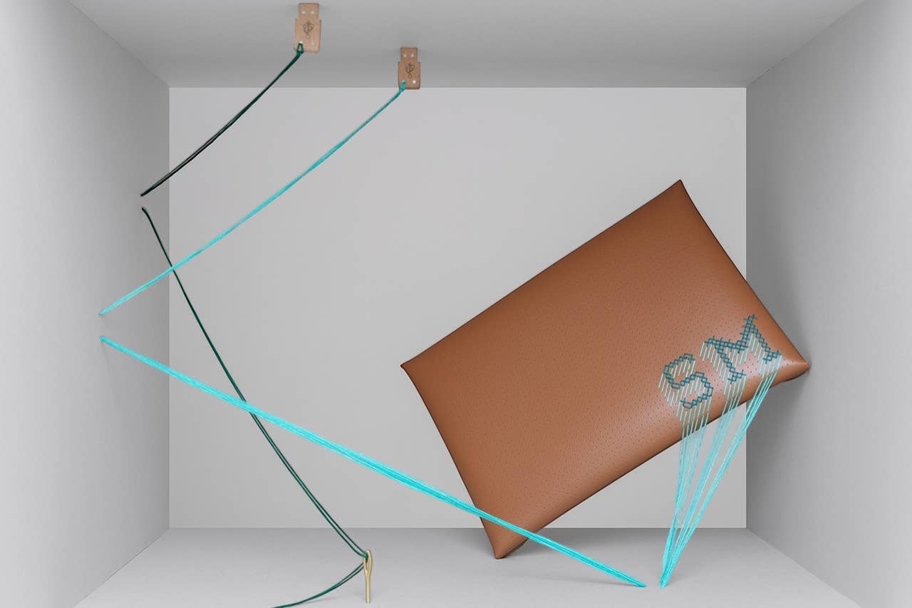 Patchwork with Busyfingers brown faux suede 13 inch laptop sleeve kit with teal and emerald threads for DIY cross stitch initials.