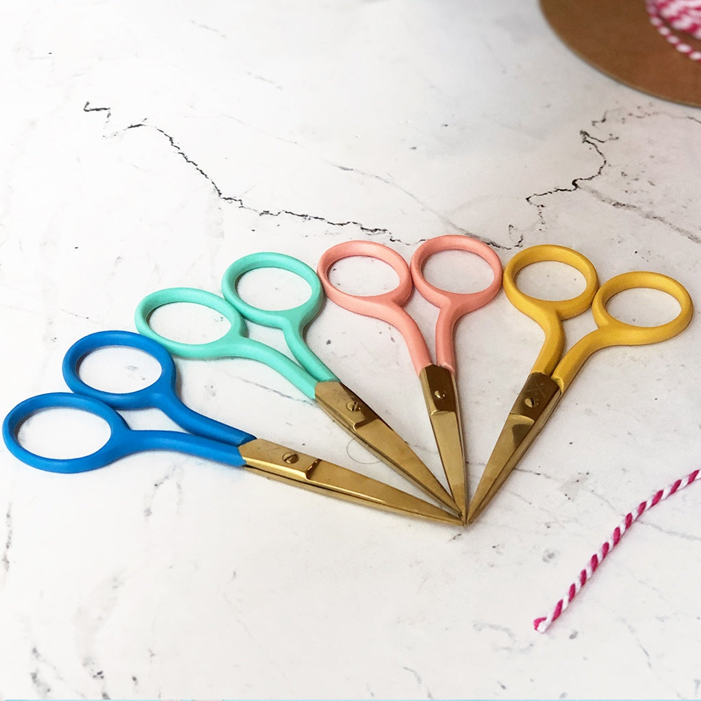 Patchwork with Busyfingers coloured embroidery scissors in blue, teal, pink, and yellow with gold blades. Stainless steel.