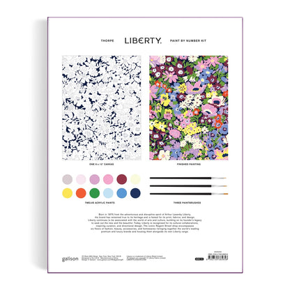 Patchwork with Busyfingers Liberty Thorpe Paint by Number Kit featuring a navy floral line drawing on canvas and a finished painting with vibrant multi-colored flowers.