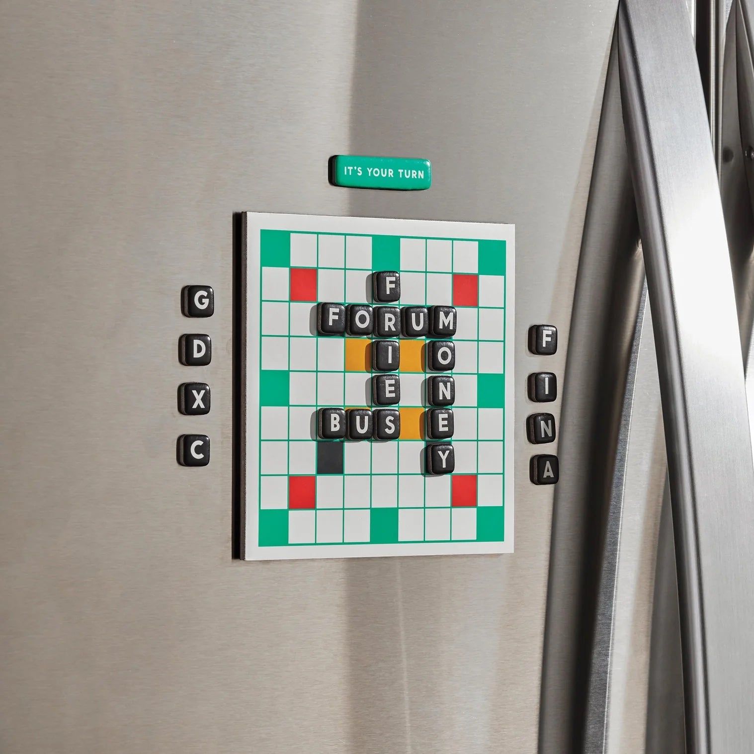 Patchwork with Busyfingers Scrumble Magnetic Fridge Game with magnetic letter tiles forming words on a green and white board.