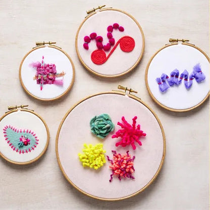 Patchwork with Busyfingers Creative Abstract Embroidery Book showing colourful textured embroidery hoops and techniques