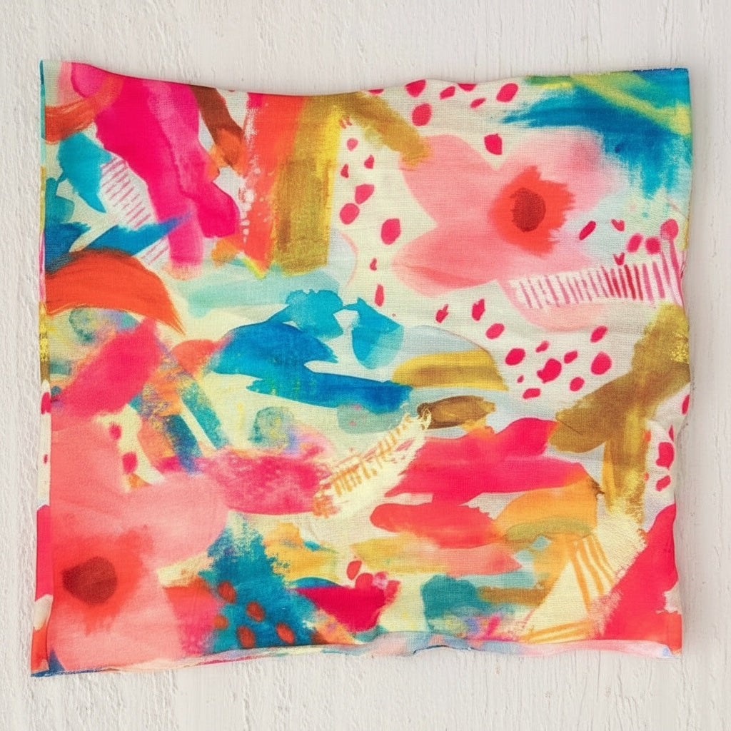 Patchwork with Busyfingers abstract floral bandeau in vibrant pink, blue, orange, and yellow. Soft, stretchy fabric.
