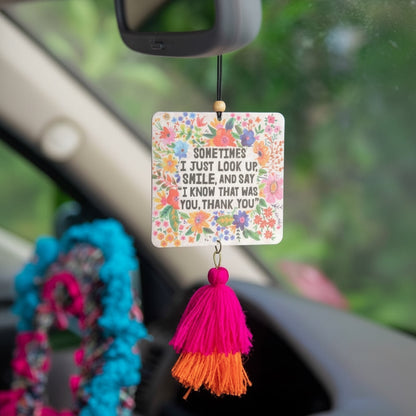 Patchwork with Busyfingers air freshener with floral design and inspirational quote, featuring a pink and orange tassel.