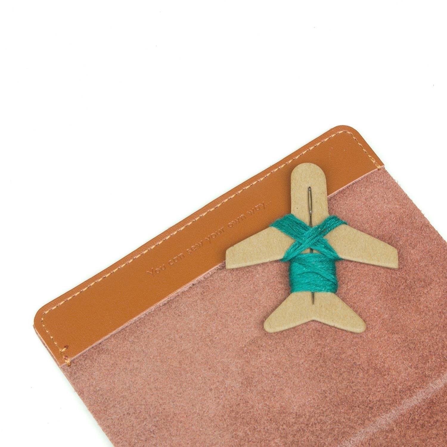 Patchwork with Busyfingers brown leather passport cover kit with world map design and emerald thread for marking visited countries.