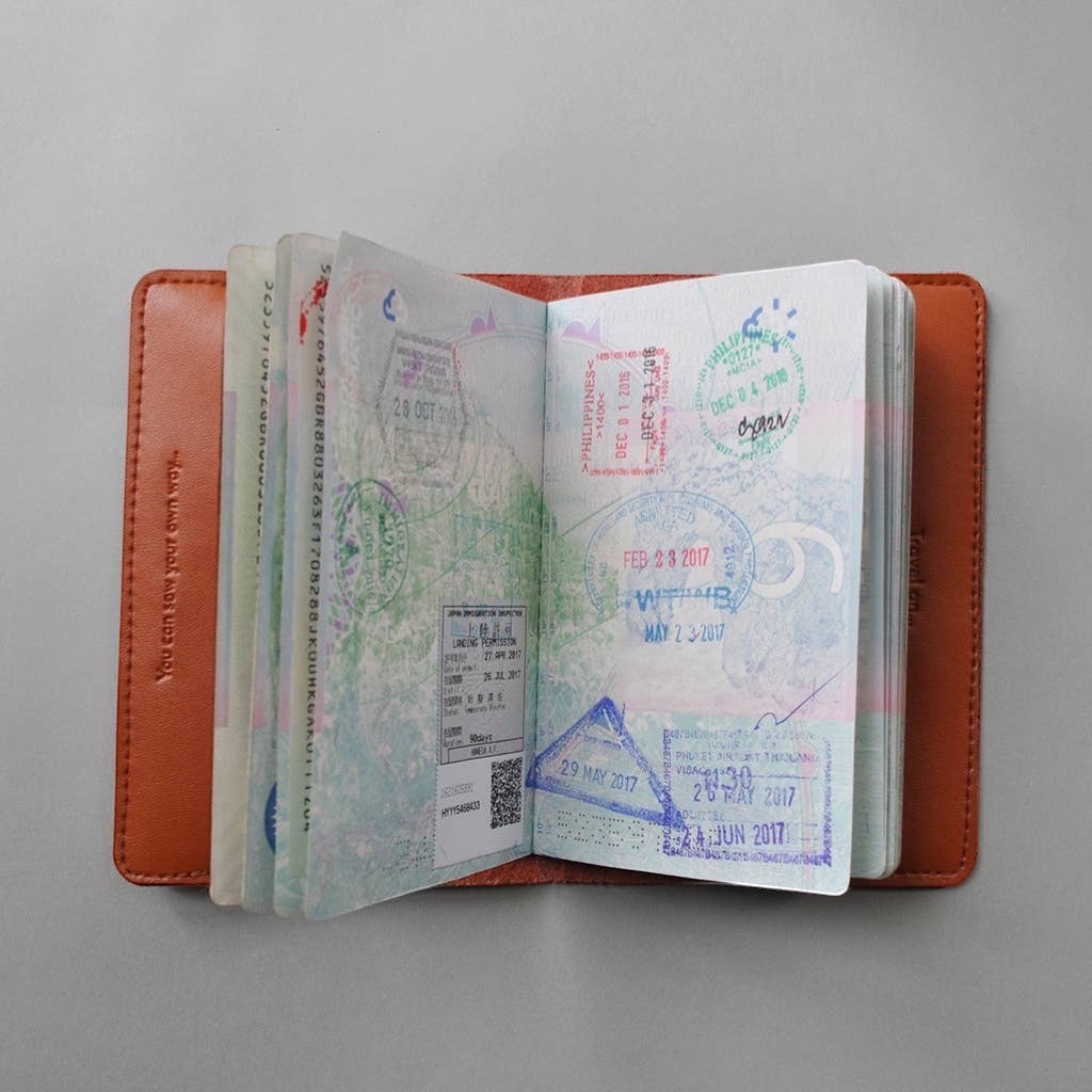 Patchwork with Busyfingers brown leather passport cover with world map print and perforated countries to stitch. Includes needle and emerald thread.