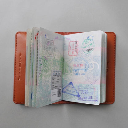 Patchwork with Busyfingers brown leather passport cover with world map print and perforated countries to stitch. Includes needle and emerald thread.