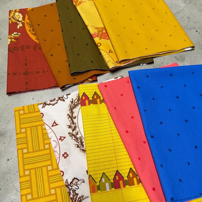 Patchwork with Busyfingers Camp Kitschy 10pc cotton fabric bundle featuring retro prints in vibrant, warm colours.
