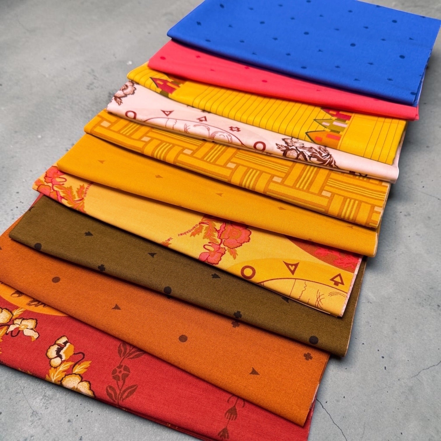 Patchwork with Busyfingers Camp Kitschy 10pc cotton fabric bundle featuring vibrant retro patterns and warm colors.