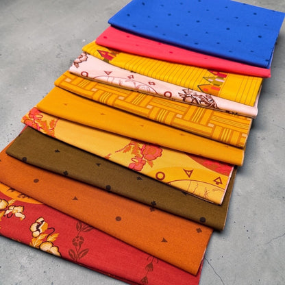 Patchwork with Busyfingers Camp Kitschy 10pc cotton fabric bundle featuring vibrant retro patterns and warm colors.