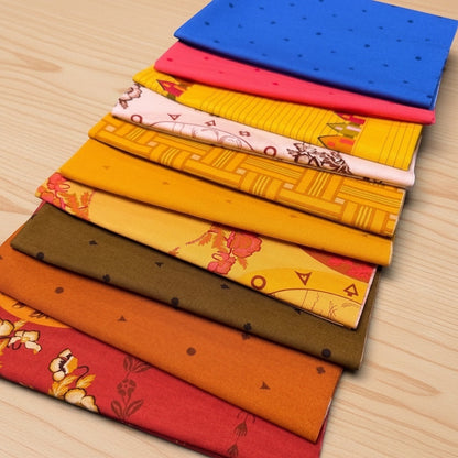 Patchwork with Busyfingers Camp Kitschy 10pc cotton fabric bundle featuring vibrant retro patterns and warm colors.