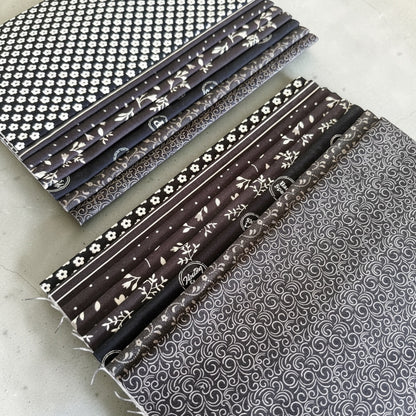 Patchwork with Busyfingers Classic Tuxedo 100% cotton fat eighth fabric pack with 8 assorted black and white prints.