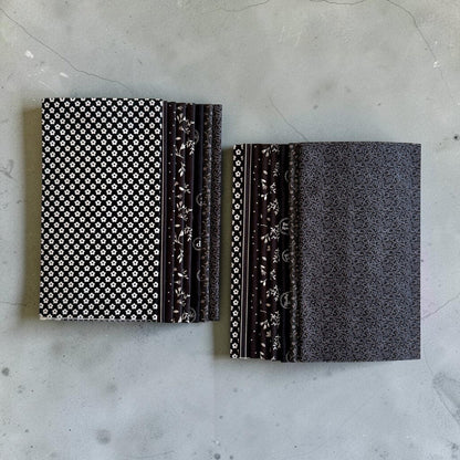 Patchwork with Busyfingers Classic Tuxedo fat eighth fabric pack featuring 8 assorted black and white cotton prints.