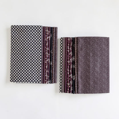 Patchwork with Busyfingers Classic Tuxedo 8-piece fat eighth cotton fabric pack with assorted black and grey prints.