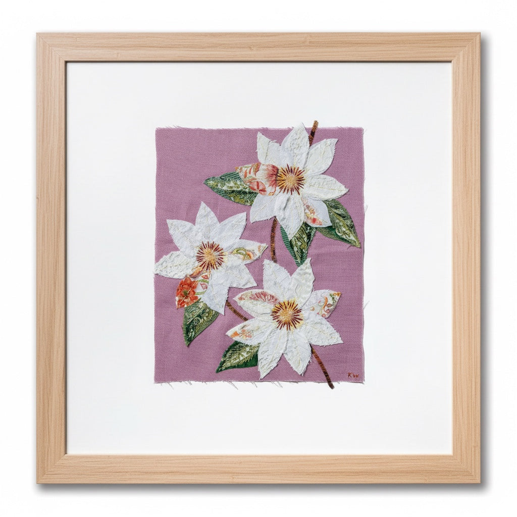 Patchwork with Busyfingers Clematis Purple slow stitching kit featuring white fabric flowers on a pastel purple linen.