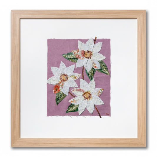 Patchwork with Busyfingers Clematis Purple slow stitching kit featuring white fabric flowers on a pastel purple linen.