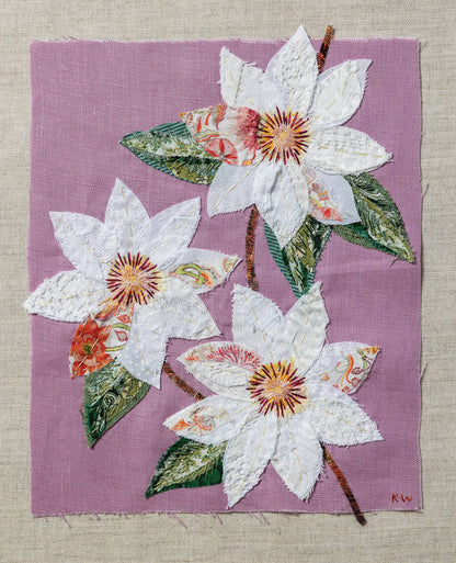 Patchwork with Busyfingers Clematis slow stitching kit featuring white fabric flowers on a pastel purple linen background