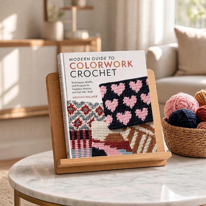Patchwork with Busyfingers Modern Guide to Colorwork Crochet book displayed on a wooden stand with yarn nearby