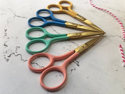 Patchwork with Busyfingers coloured embroidery scissors in yellow, blue, teal, and coral with gold blades. Stainless steel, pointed blades for precision.