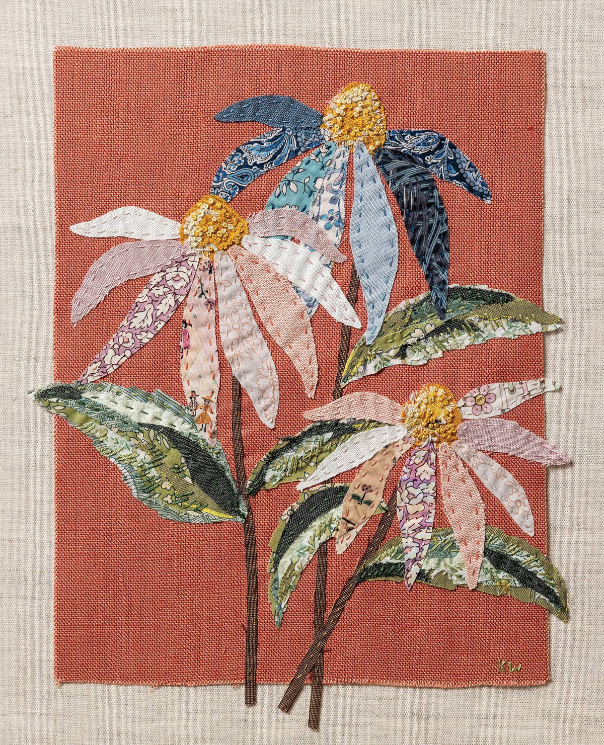 Patchwork with Busyfingers coneflower slow stitching kit featuring pastel fabric flowers on red clay linen canvas.