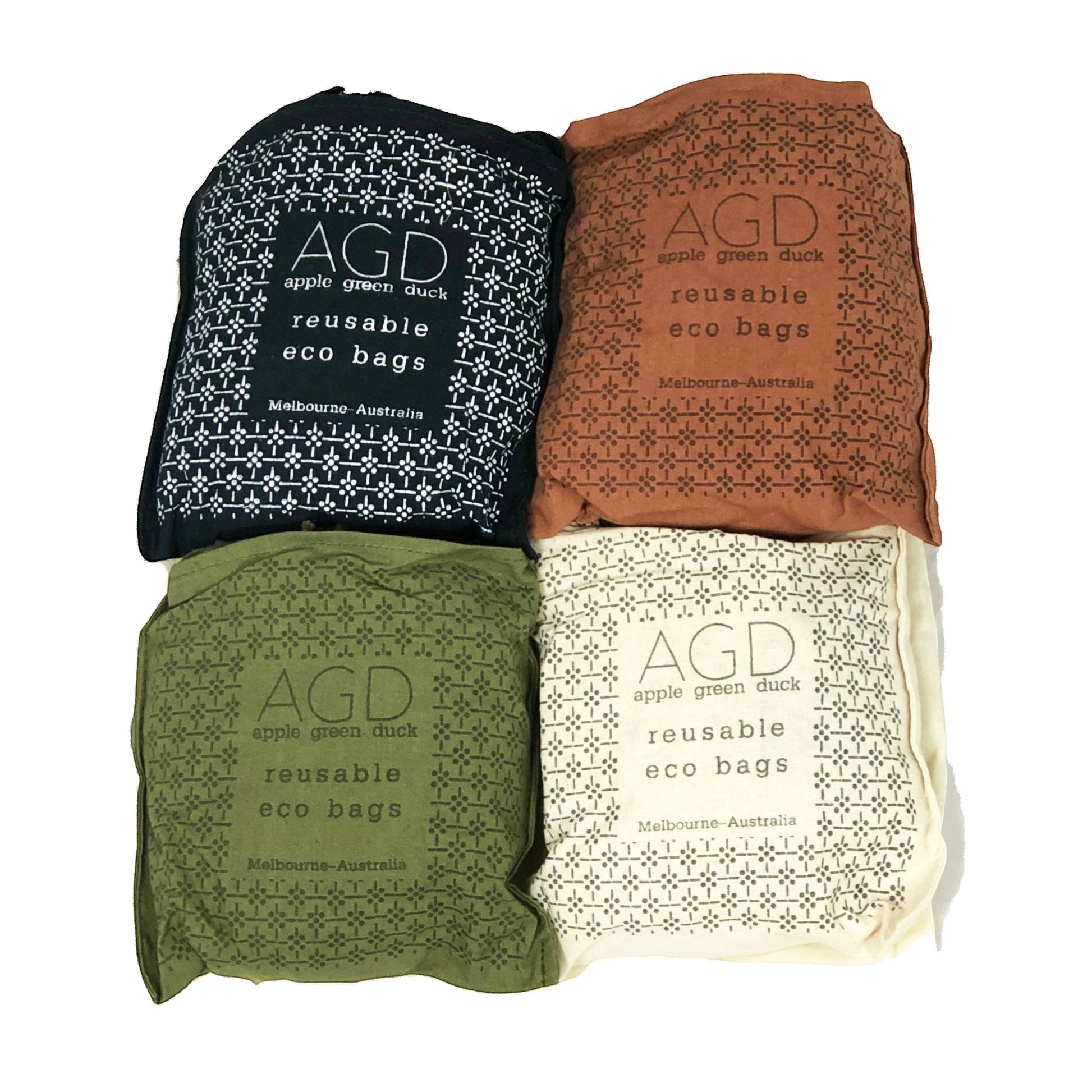 Patchwork with Busyfingers cotton net bags in rust, natural, midnight, and forest green. Reusable eco bags with long handles.