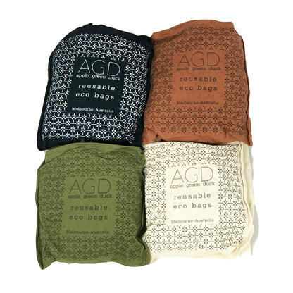 Patchwork with Busyfingers cotton net bags in rust, natural, midnight, and forest green. Reusable eco bags with long handles.