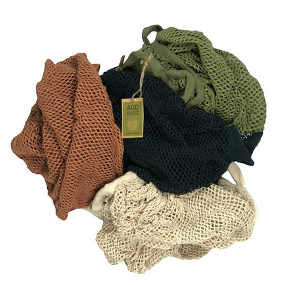 Patchwork with Busyfingers 100% cotton net crescent bag in rust, natural, midnight and forest green.