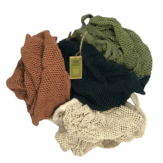 Patchwork with Busyfingers 100% cotton net crescent bag in rust, natural, midnight and forest green.