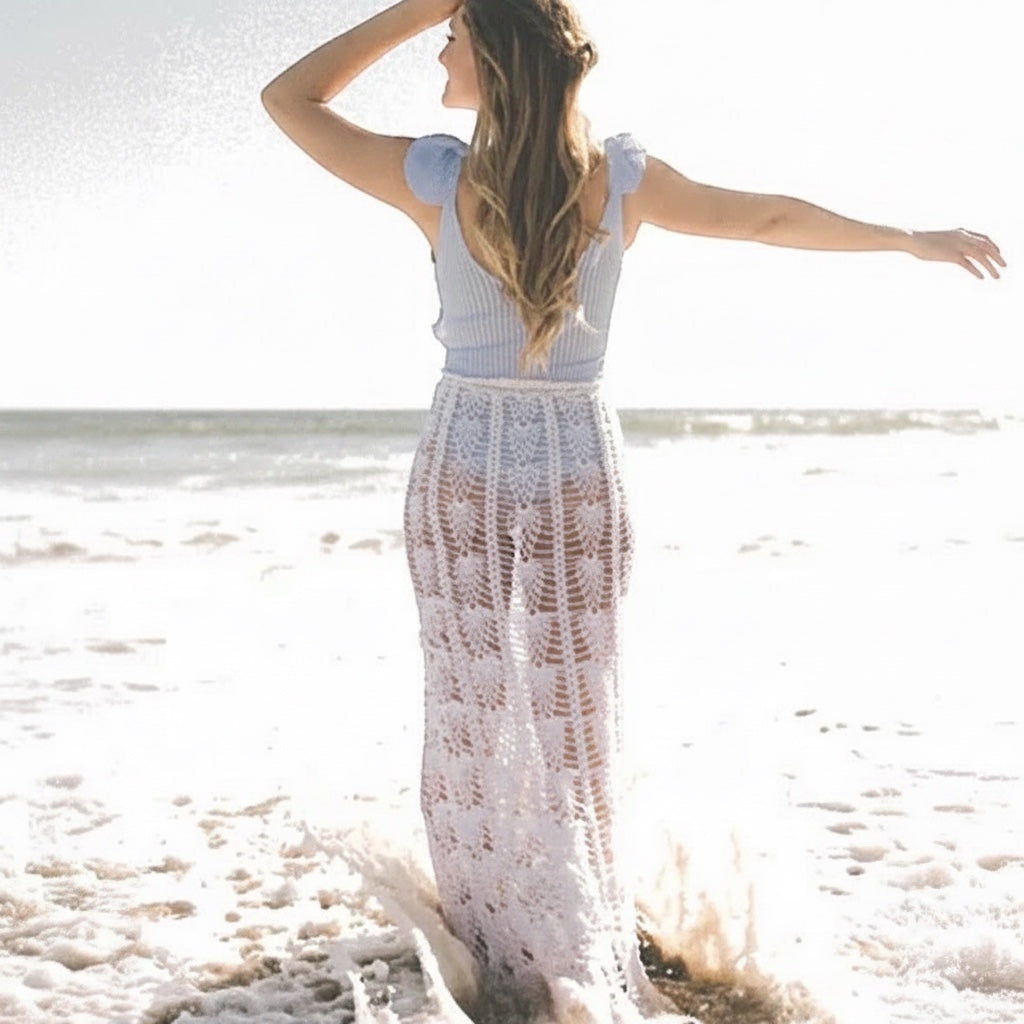 Patchwork with Busyfingers Summer Crochet book features a woman wearing a white lace crochet beach dress at the ocean.