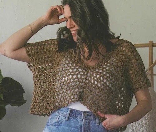 Model wearing a brown open-knit crochet top from the Patchwork with Busyfingers Crochet Layers to Love book