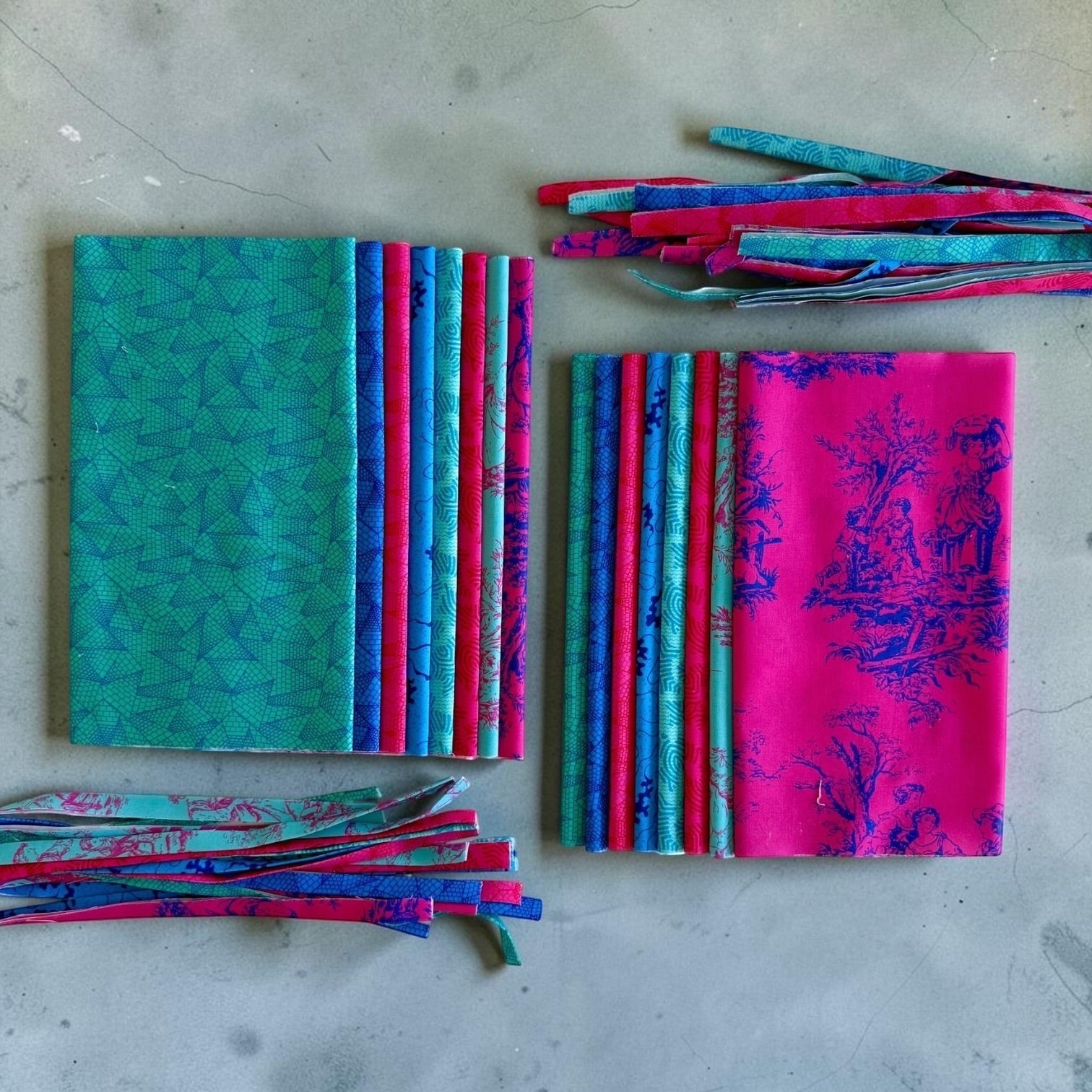 Patchwork with Busyfingers Electric Lagoon 8-piece cotton fabric fat eighth pack in vibrant pink and teal prints.