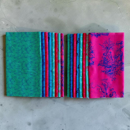 Patchwork with Busyfingers Electric Lagoon fat eighth cotton fabric pack with 8 assorted blue, teal, and pink prints.