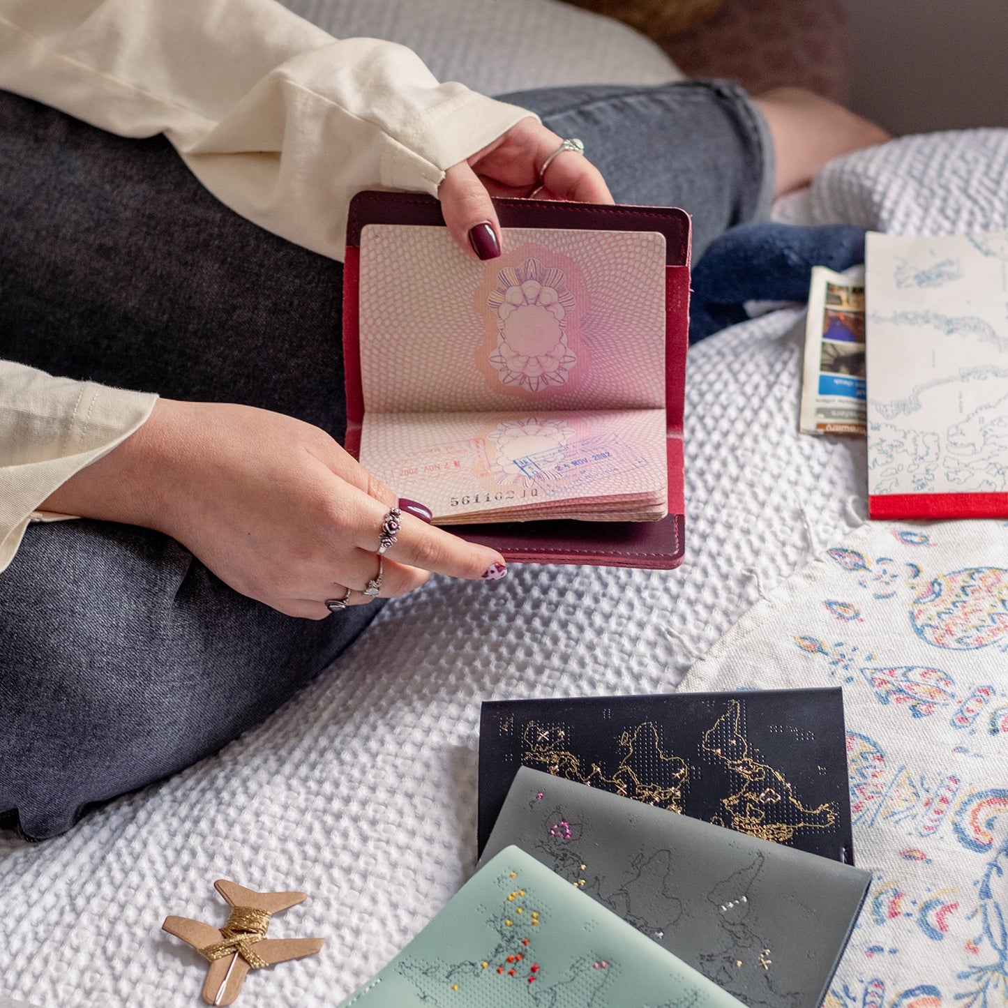 Patchwork with Busyfingers faux leather passport holder with embroidered world map design, perfect for marking travels.