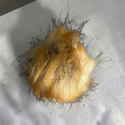 Patchwork with Busyfingers plush faux fur beanie pom pom in golden brown with dark tipped long fibers