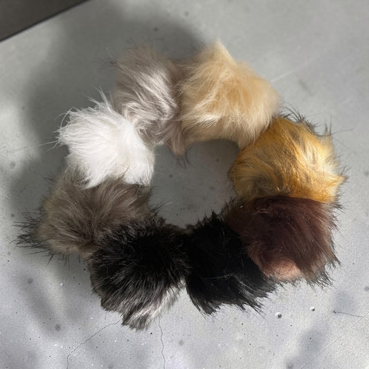 Patchwork with Busyfingers plush faux fur pom poms in a variety of neutral and brown tones for beanie hats