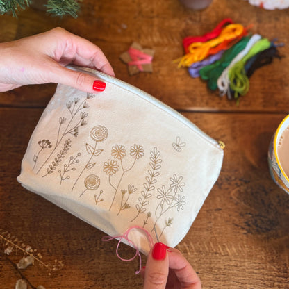 Patchwork with Busyfingers floral embroidery kit on a canvas zip pouch with meadow design and bee. Includes threads and needle.