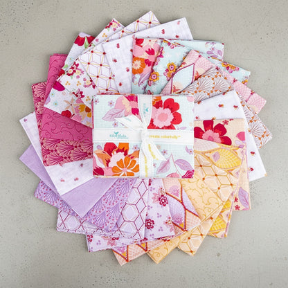 Patchwork with Busyfingers Flourish 21-piece fabric bundle featuring floral and geometric patterns in pink and orange.