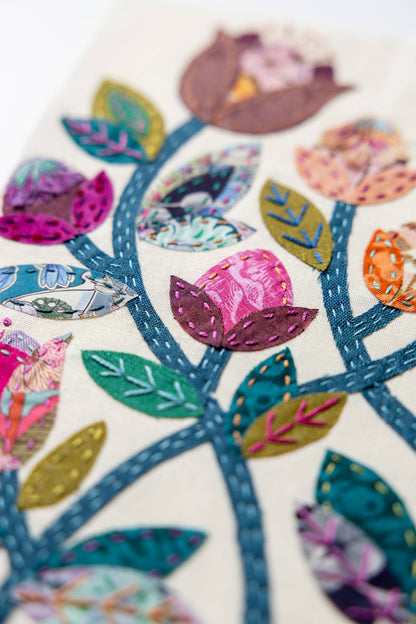 Patchwork with Busyfingers Folk Fleur slow stitching kit featuring vibrant floral fabric applique on linen background