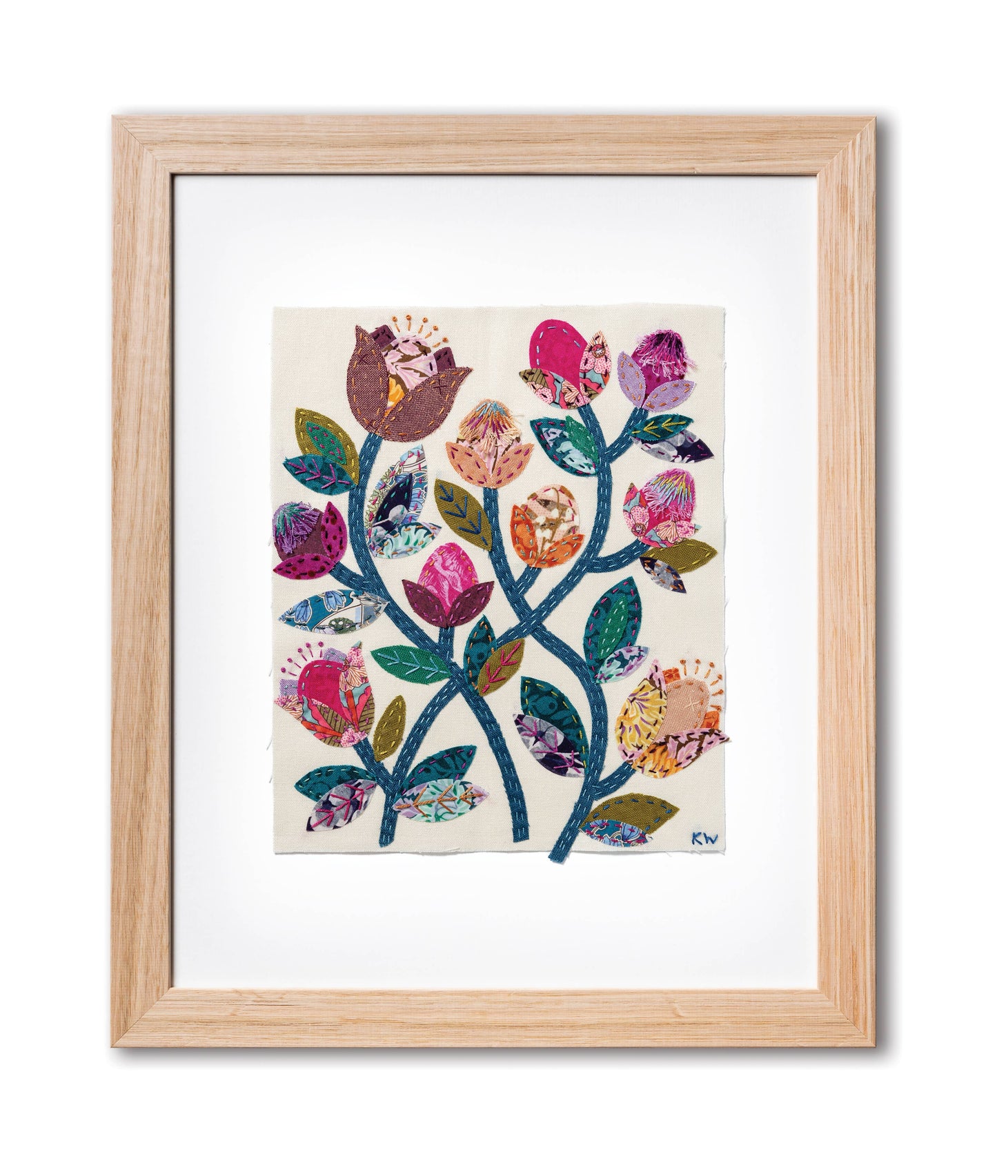 Patchwork with Busyfingers Folk Fleur slow stitching kit featuring vibrant floral fabric applique in a wooden frame.
