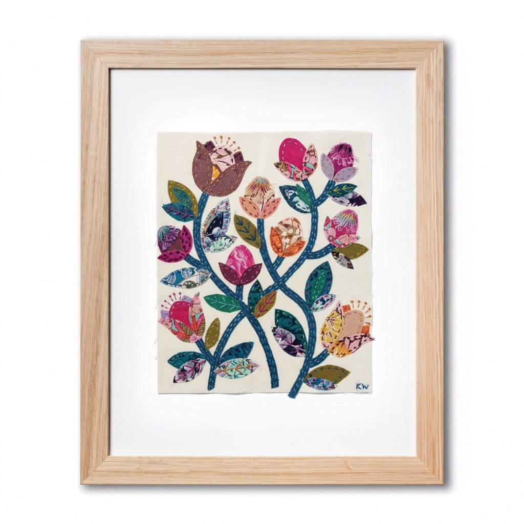 Patchwork with Busyfingers Folk Fleur slow stitching kit featuring vibrant floral fabric applique in a wooden frame.