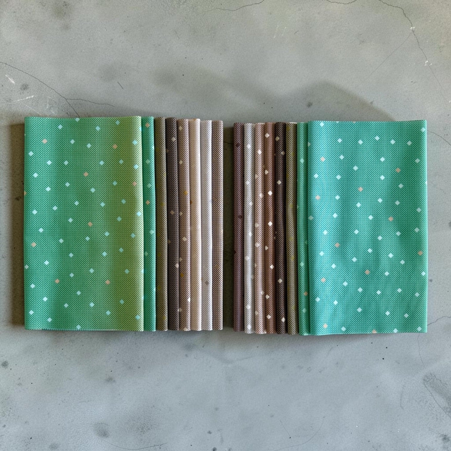 Patchwork with Busyfingers Forest Fog 8-piece fat eighth cotton fabric bundle in green and brown geometric prints.