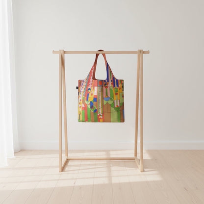Patchwork with Busyfingers Frank Lloyd Wright Liberty shopper tote in TPU with geometric architectural motifs in red, green, yellow, blue, and orange.