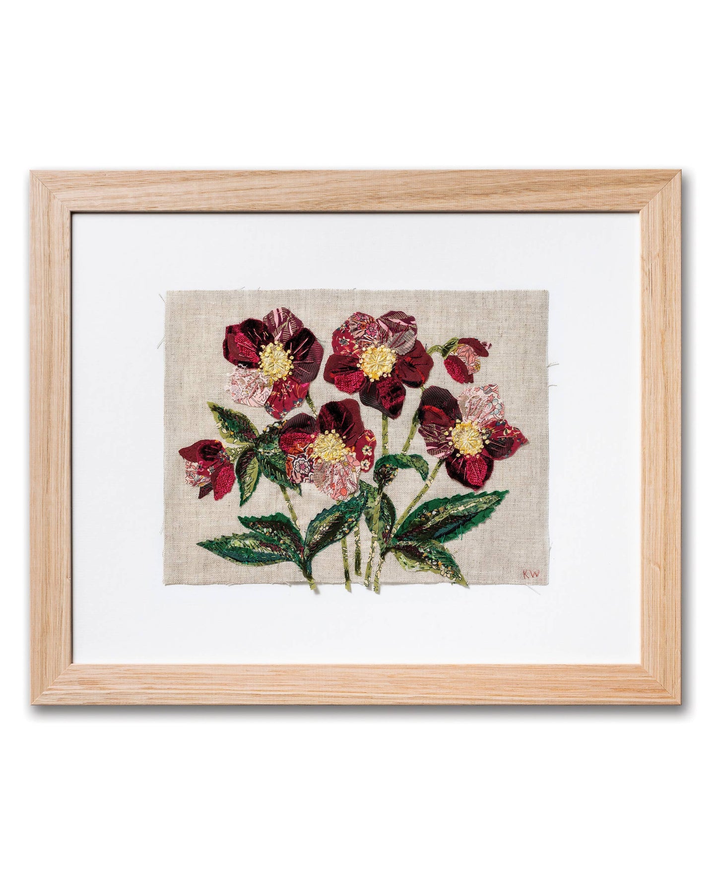 Patchwork with Busyfingers Hellebores slow stitching kit featuring burgundy floral fabric art in a light wood frame.