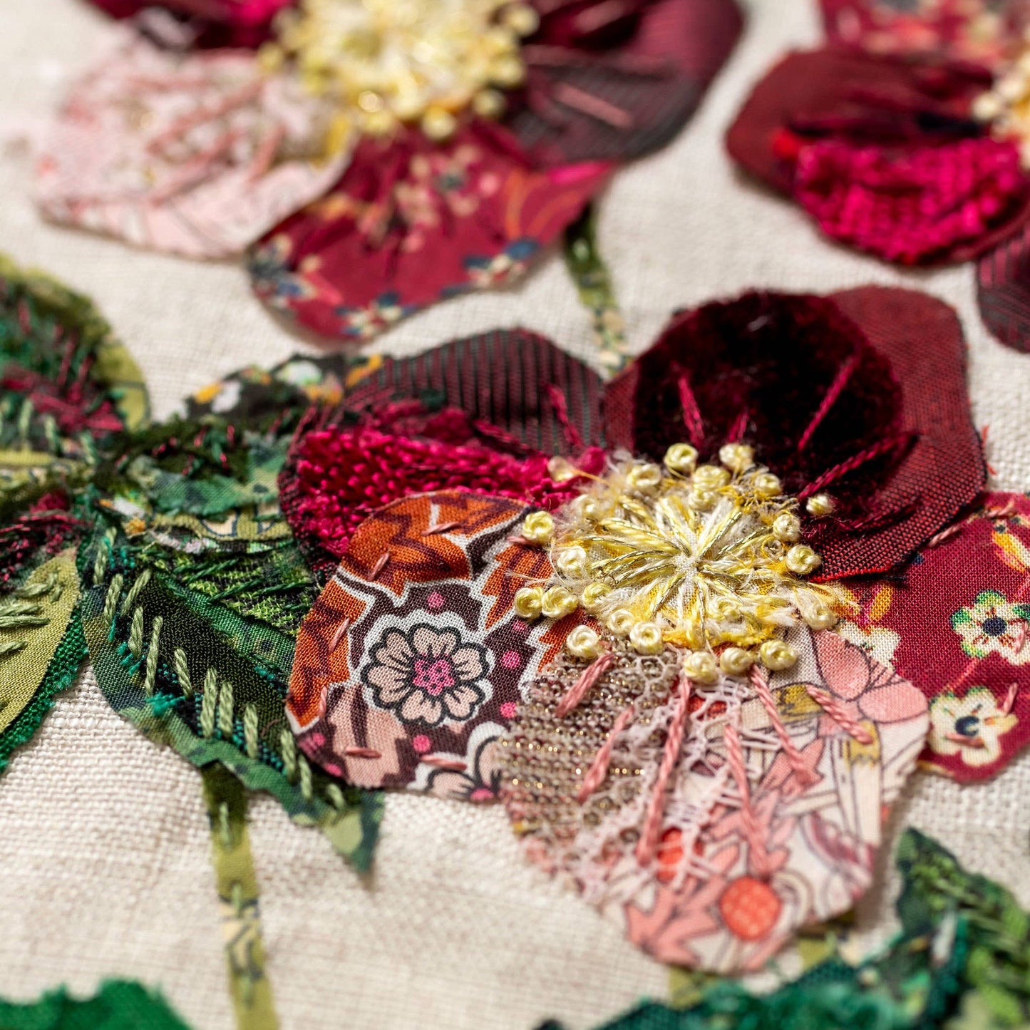 Patchwork with Busyfingers Hellebores slow stitching kit featuring burgundy velvet, silk, and Liberty floral fabrics.