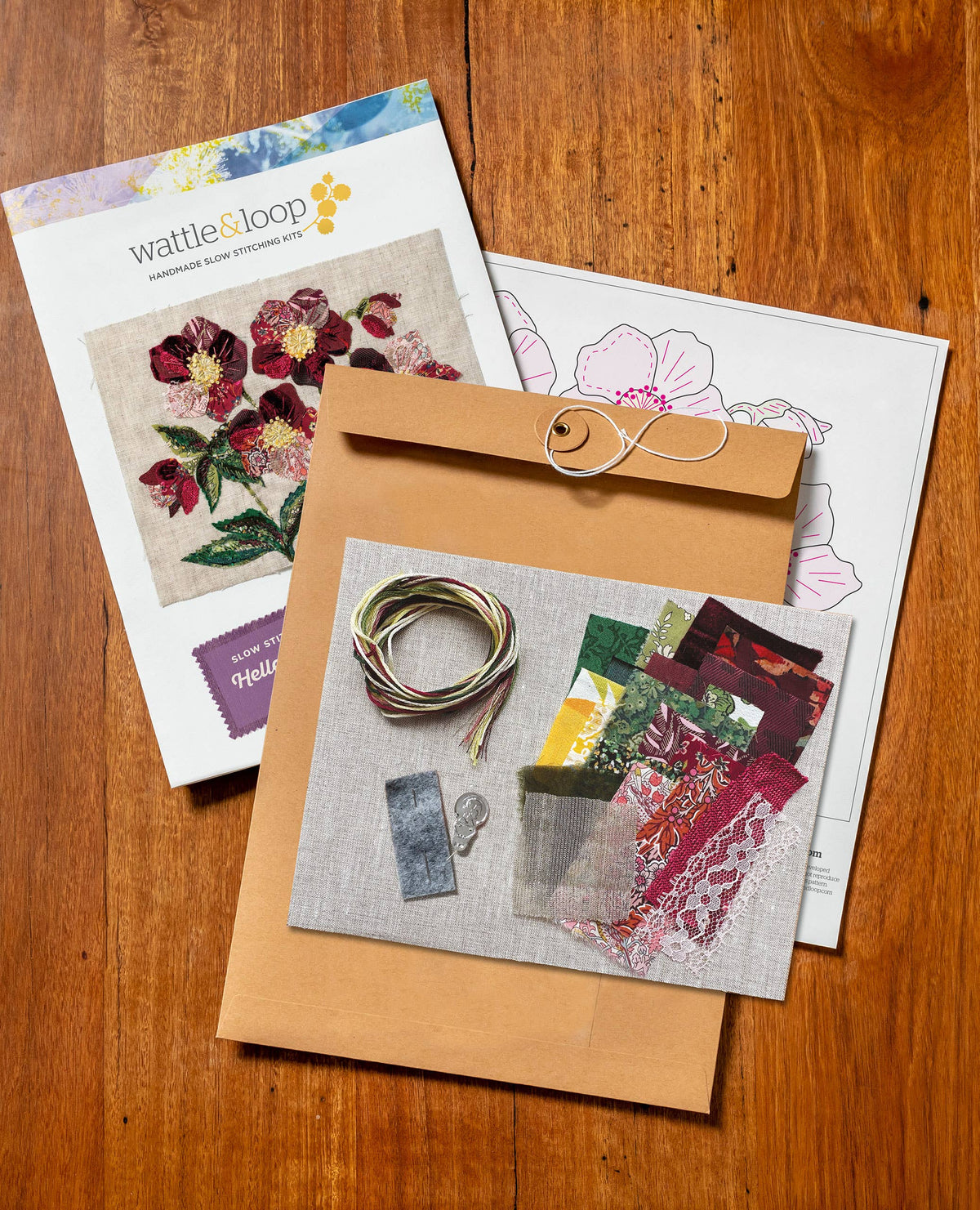 Patchwork with Busyfingers Hellebores slow stitching kit with fabric scraps, embroidery threads, and pattern guide.