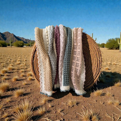 Patchwork with Busyfingers Hidden Stitch yarn set in cream, sand, dusty pink, and light grey crochet blanket with textured stitches.
