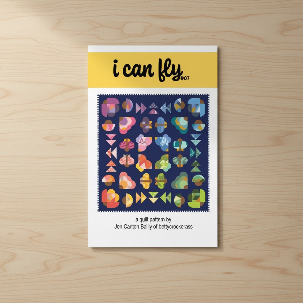 Patchwork with Busyfingers I Can Fly quilt pattern booklet featuring colorful improv-style moth motifs on navy blue.