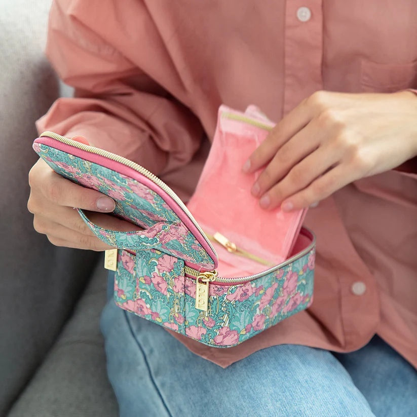 Patchwork with Busyfingers Liberty floral print small jewellery cube with pink suedette lining, held open by a person.