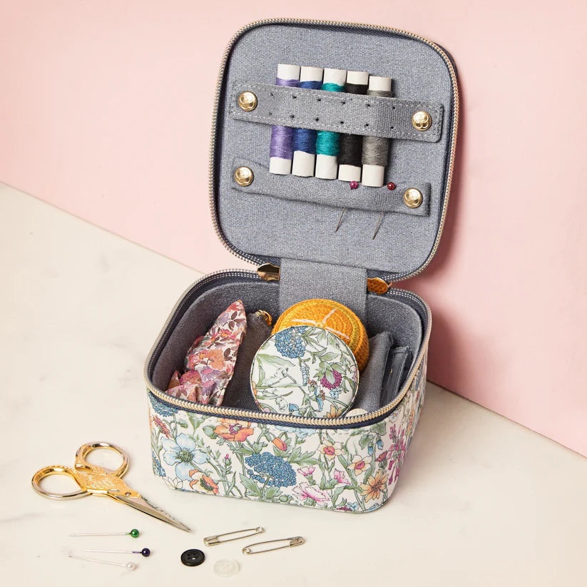 Patchwork with Busyfingers Liberty small sewing cube with floral print, grey interior, thread spools, needles, scissors, and pins.