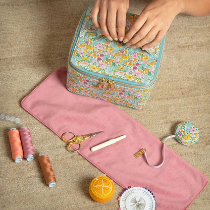 Patchwork with Busyfingers Liberty Tana Lawn measuring tape with floral print and gold tab, with sewing accessories.