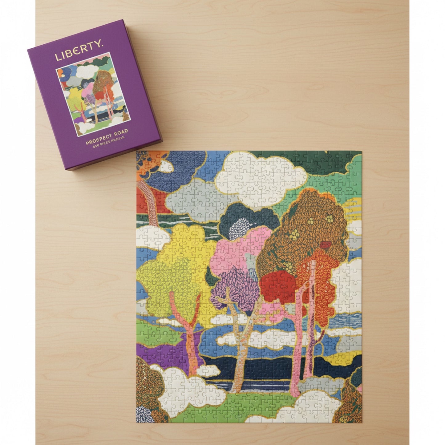 Patchwork with Busyfingers Liberty Prospect Road 500 piece puzzle in a purple book-style box with a colourful floral landscape.
